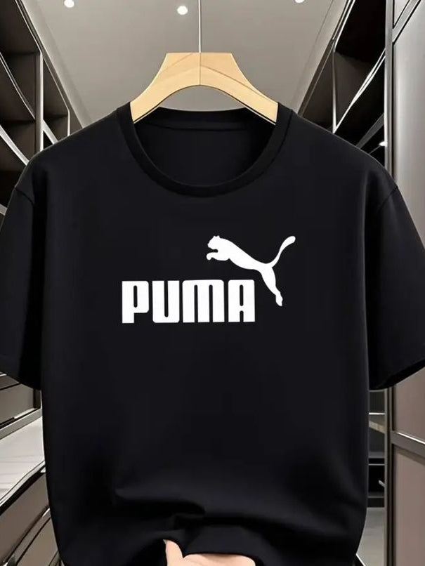 Black Puma t-shirt on a hanger with a blurred background